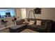 Comfortable sectional sofa and breakfast bar enhance this living room at 8070 W Russell Rd # 1105, Las Vegas, NV 89113