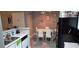 Open-concept space with white kitchen cabinets and a dining area at 8070 W Russell Rd # 1105, Las Vegas, NV 89113