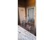 Exterior patio with a dog featuring two chairs and a sliding glass door entrance at 8070 W Russell Rd # 1105, Las Vegas, NV 89113