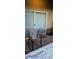 Exterior patio showcasing two chairs and a sliding glass door entrance at 8070 W Russell Rd # 1105, Las Vegas, NV 89113