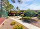 Attractive apartment complex featuring meticulous landscaping, vibrant flowers, and nearby tennis court at 8070 W Russell Rd # 2070, Las Vegas, NV 89113