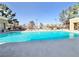 Large community pool offering residents a refreshing retreat on a sunny day, surrounded by lounge chairs at 8070 W Russell Rd # 2070, Las Vegas, NV 89113