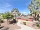 Community tennis court surrounded by trees and greenery, offering a great recreational amenity at 8070 W Russell Rd # 2070, Las Vegas, NV 89113