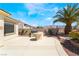 Backyard featuring desert landscaping, a built-in grill, and mountain views at 8236 Imperial Lakes St, Las Vegas, NV 89131