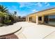 Large backyard featuring a covered patio and well-maintained landscaping at 8236 Imperial Lakes St, Las Vegas, NV 89131