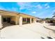 Covered backyard patio with desert landscaping, a built-in grill, and mountain views at 8236 Imperial Lakes St, Las Vegas, NV 89131