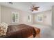 Bright bedroom with ample natural light, ceiling fan, and neutral wall paint at 8236 Imperial Lakes St, Las Vegas, NV 89131