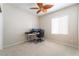 Bedroom with carpet flooring, fan, and a large window for natural light at 8236 Imperial Lakes St, Las Vegas, NV 89131