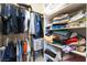 Spacious closet with rods and shelves, designed for organized clothing and accessories storage at 8236 Imperial Lakes St, Las Vegas, NV 89131