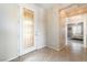 Welcoming foyer with decorative front door and a view into a bedroom at 8236 Imperial Lakes St, Las Vegas, NV 89131