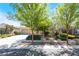 Charming single-story home featuring mature trees, lush landscaping, and an inviting curb appeal at 8236 Imperial Lakes St, Las Vegas, NV 89131