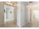 Open hallway featuring tile flooring with neutral paint, and easy access to rooms at 8236 Imperial Lakes St, Las Vegas, NV 89131