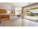 Bright open kitchen with wood cabinets, tile floors, and stainless steel appliances at 8236 Imperial Lakes St, Las Vegas, NV 89131