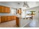 Bright, open kitchen featuring wood cabinets, a spacious island, and modern appliances at 8236 Imperial Lakes St, Las Vegas, NV 89131