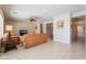 The living room has tile flooring, a ceiling fan, and comfortable seating at 8236 Imperial Lakes St, Las Vegas, NV 89131