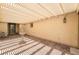 Charming covered patio featuring brick flooring, fountain, and elegant outdoor furniture at 8236 Imperial Lakes St, Las Vegas, NV 89131