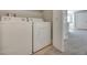 Laundry room features a side-by-side washer and dryer, with a door to an adjacent room at 8804 River Pines Ct # 202, Las Vegas, NV 89117