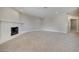 Open living room featuring neutral carpet, recessed lighting, and a cozy white fireplace at 8804 River Pines Ct # 202, Las Vegas, NV 89117
