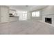 Inviting living room with a fireplace, opening to the kitchen with bar seating and neutral paint at 8804 River Pines Ct # 202, Las Vegas, NV 89117
