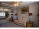 Comfortable bedroom featuring neutral tones, mirrorred closet, and a ceiling fan at 9905 Fox Springs Dr, Las Vegas, NV 89117