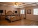 Stylish bedroom with wood flooring, plantation shutters, and a spacious layout at 9905 Fox Springs Dr, Las Vegas, NV 89117