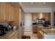 Warm and inviting kitchen with wooden cabinets, granite countertops, and modern appliances, perfect for cooking at 9905 Fox Springs Dr, Las Vegas, NV 89117