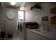 Bright laundry room with appliances, storage, and a practical layout at 9905 Fox Springs Dr, Las Vegas, NV 89117