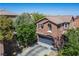Bird's eye view of home showcasing the roof, landscaping, and architectural details at 10030 Trotter Peak St, Las Vegas, NV 89178