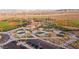 Aerial community view showcases baseball fields, parking, playgrounds and well-kept grounds offering an active lifestyle at 10030 Trotter Peak St, Las Vegas, NV 89178