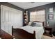 Cozy bedroom features a comfortable bed, ample storage with a built-in bookshelf, and a calming color scheme for relaxation at 10030 Trotter Peak St, Las Vegas, NV 89178