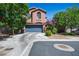 Charming two-story house with a well-maintained lawn and attached garage at 10030 Trotter Peak St, Las Vegas, NV 89178
