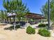 Inviting covered picnic area with multiple tables, perfect for outdoor gatherings and enjoying the beautiful surroundings at 10030 Trotter Peak St, Las Vegas, NV 89178