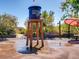 Fun splash pad featuring a water tower and playful water features for outdoor entertainment on hot days at 10030 Trotter Peak St, Las Vegas, NV 89178