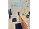 Bright bathroom features double sinks, tub, and modern vanity at 10680 Sapphire Vista Ave, Las Vegas, NV 89144