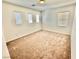 Bright bedroom with plush carpet and large windows offering ample natural light at 10680 Sapphire Vista Ave, Las Vegas, NV 89144