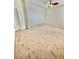 Spacious bedroom with neutral carpet, ceiling fan, and ample natural light at 10680 Sapphire Vista Ave, Las Vegas, NV 89144