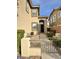 Charming home with a gated front entrance, well-maintained landscaping, and a welcoming front door at 10680 Sapphire Vista Ave, Las Vegas, NV 89144
