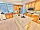 Kitchen featuring light-colored cabinets, stainless appliances, and a center island at 10680 Sapphire Vista Ave, Las Vegas, NV 89144