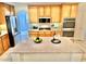 Bright kitchen features stainless appliances, granite countertops, and large center island at 10680 Sapphire Vista Ave, Las Vegas, NV 89144