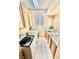 Functional laundry room with cabinets, sink, and washer/dryer at 10680 Sapphire Vista Ave, Las Vegas, NV 89144
