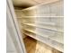 Pantry features adjustable shelving and tile flooring for organized storage at 10680 Sapphire Vista Ave, Las Vegas, NV 89144