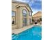 Backyard with pool, spa, seating, and mature plants at 10680 Sapphire Vista Ave, Las Vegas, NV 89144
