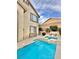 Sparkling pool and spa, complimented by outdoor furniture for relaxation at 10680 Sapphire Vista Ave, Las Vegas, NV 89144