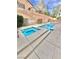 Beautiful swimming pool and spa with a custom design and landscaping at 10680 Sapphire Vista Ave, Las Vegas, NV 89144