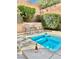 Intimate spa area with lush landscaping, providing a serene escape at 10680 Sapphire Vista Ave, Las Vegas, NV 89144