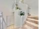 Elegant staircase with white railings and decorative niches at 10680 Sapphire Vista Ave, Las Vegas, NV 89144