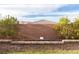 Landscaped backyard with planter bed and a view of the surrounding hills, perfect for gardening at 16 Cresta Villa Ct, Henderson, NV 89011