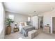 Serene bedroom with ample natural light and stylish accents, connected to the ensuite bathroom via a barn door at 16 Cresta Villa Ct, Henderson, NV 89011