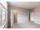 Well-lit bedroom with carpet, showing access to a closet and the rest of the house at 16 Cresta Villa Ct, Henderson, NV 89011