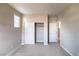 A carpeted bedroom with a closet and access to other rooms at 16 Cresta Villa Ct, Henderson, NV 89011